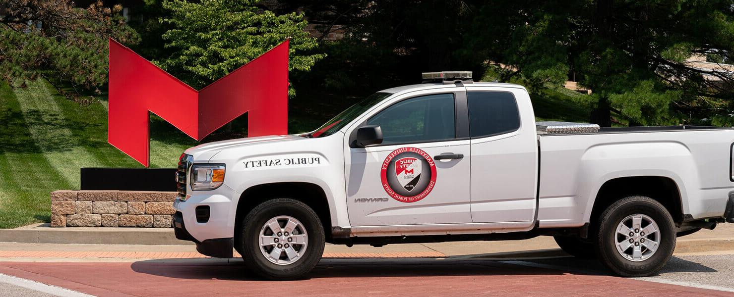 Public safety truck sitting in front of the Red M.